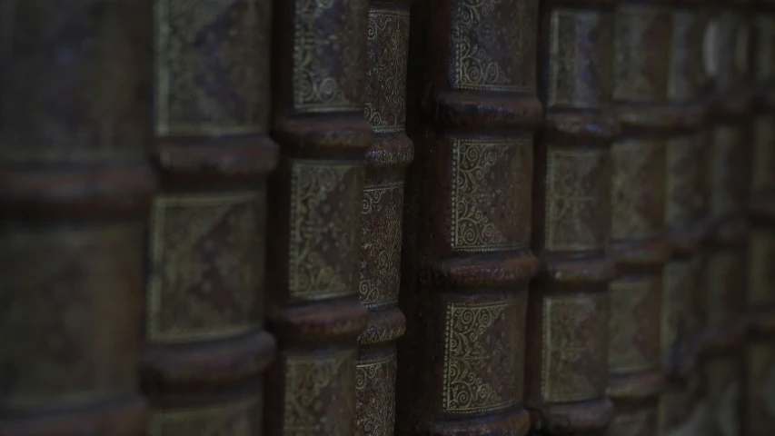 many books with carved covers on each one