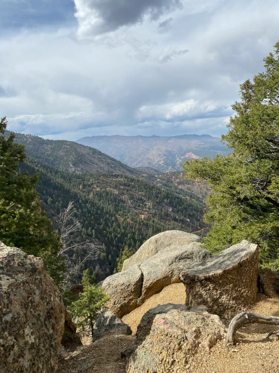 a view of mountains and rocks from top of a mountain