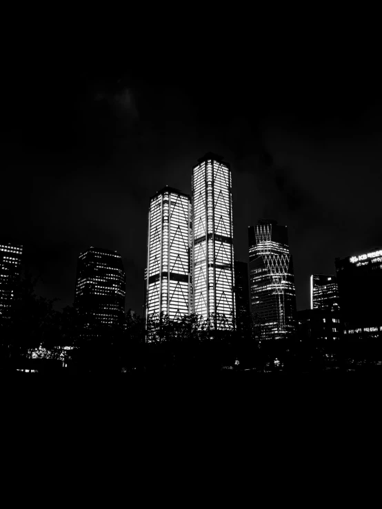 city skyline at night with skyscrs in the background