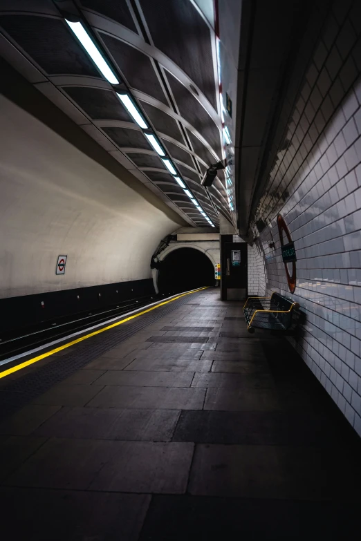 a black and white po of a subway station with people