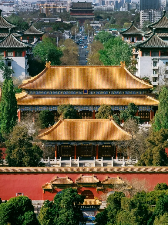 an image of a chinese structure with many trees in front
