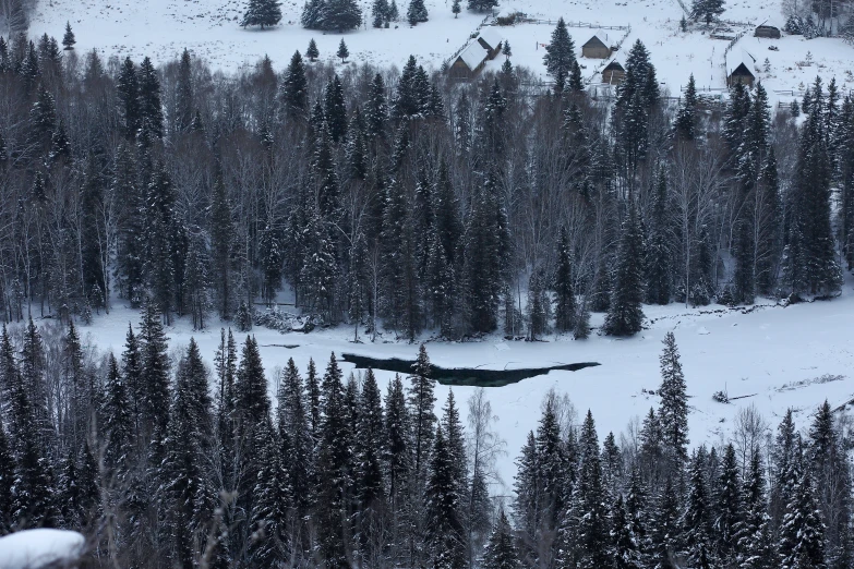 the top of a snowy mountain covered with snow