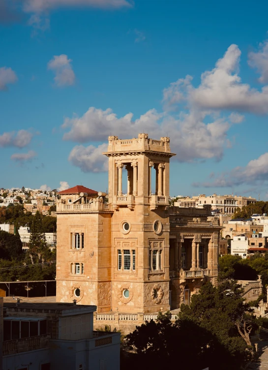 a building with two towers is on a sunny day