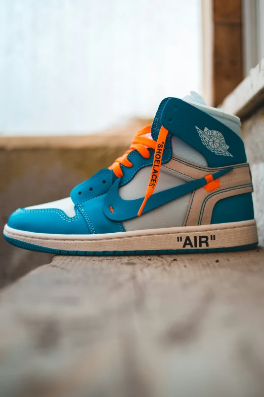 the air jordan 1 high top sneaker blue grey orange and white