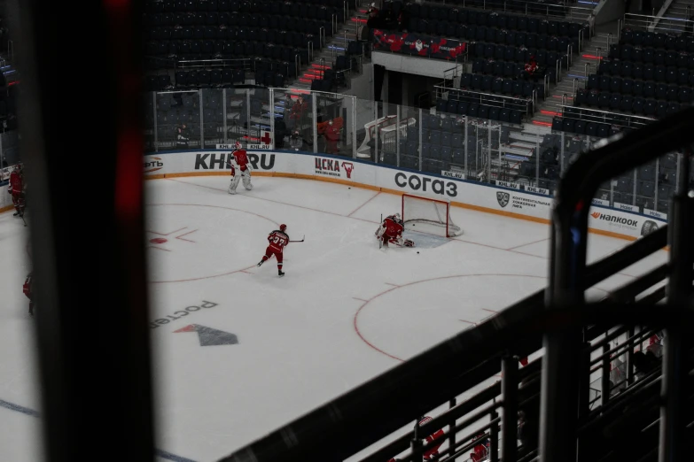 a hockey player getting ready to make a s at the goal