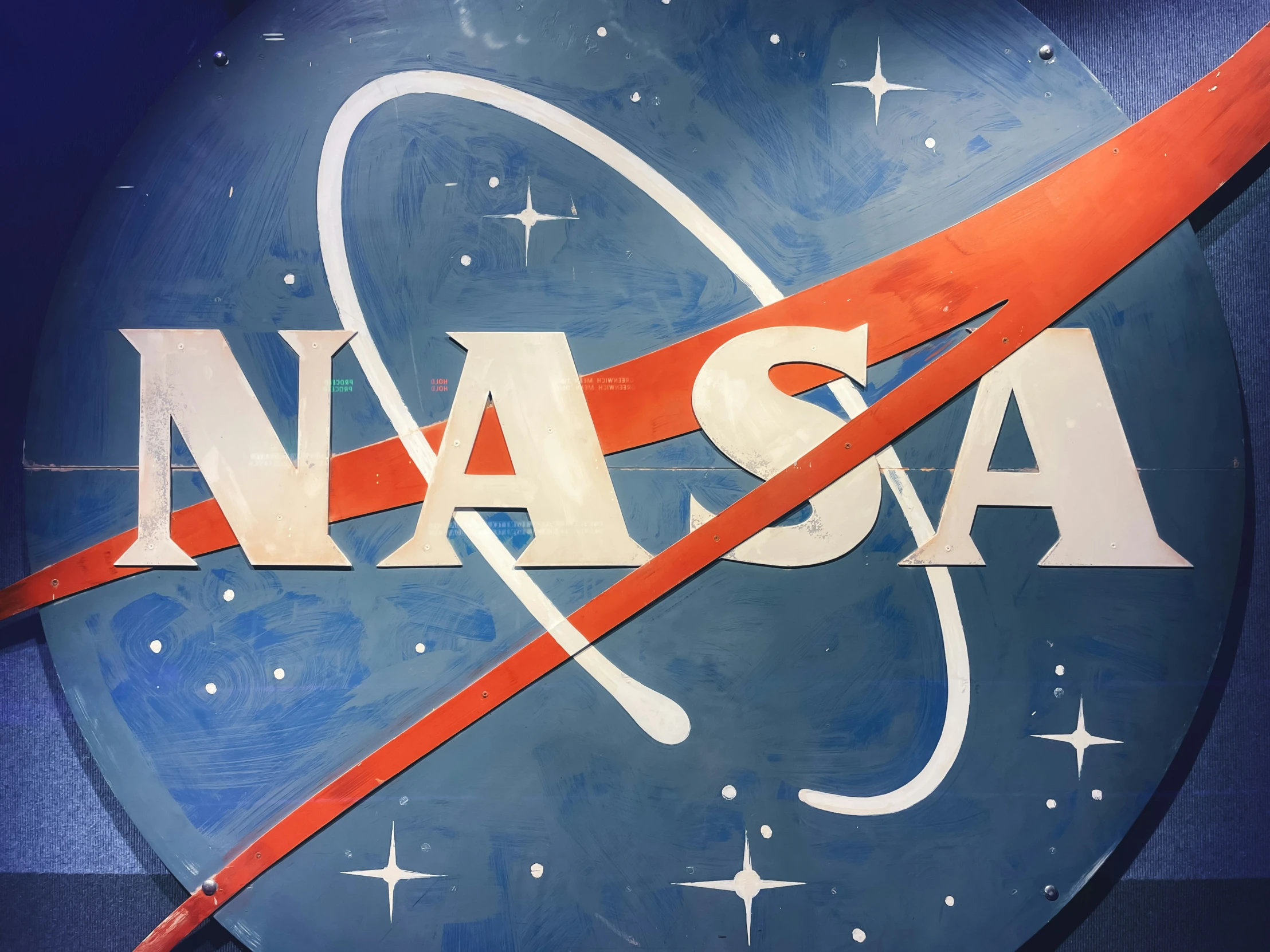 nasa logo, with stars and an orange band