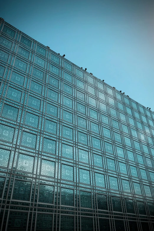 the exterior of an office building that has glass walls