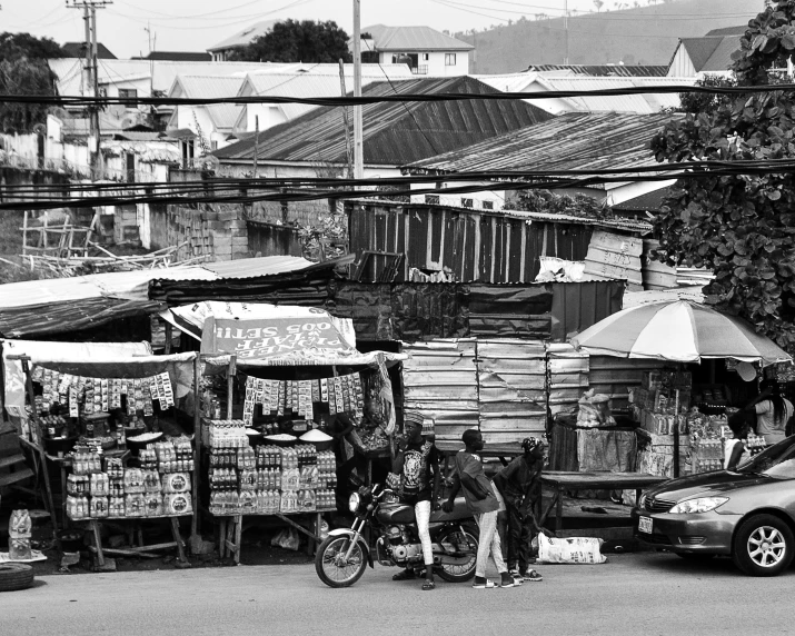 an urban area with several fruit and vegetable vendors