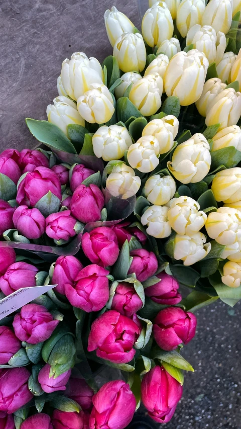 many tulips and other flowers in a bouquet