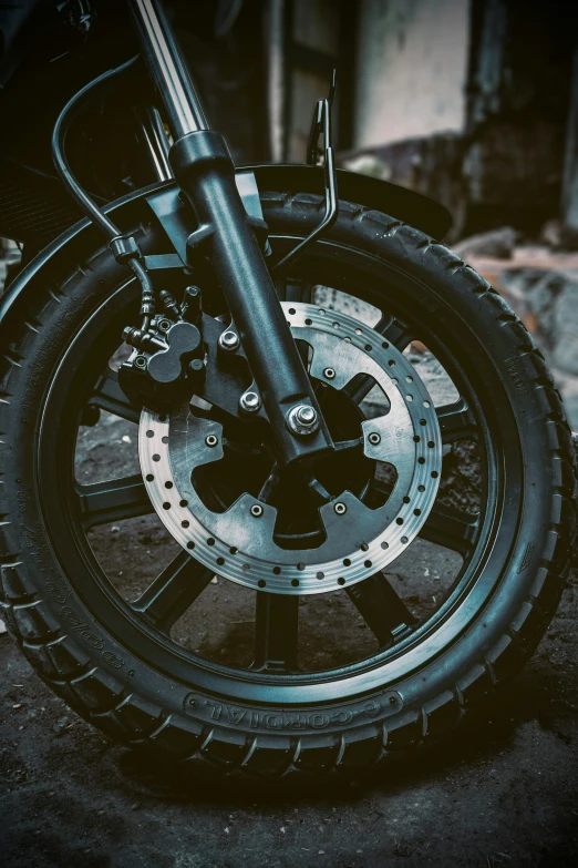 a close up of a motorcycle tire and spokes