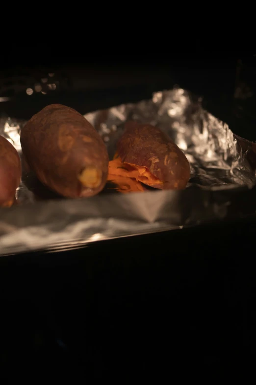 some potato patties on tin foil in the kitchen