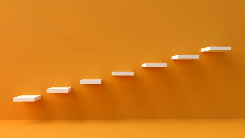 an orange wall with white stairs in the center