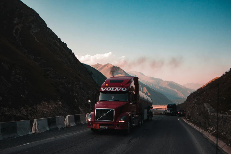 a big red truck driving down the road