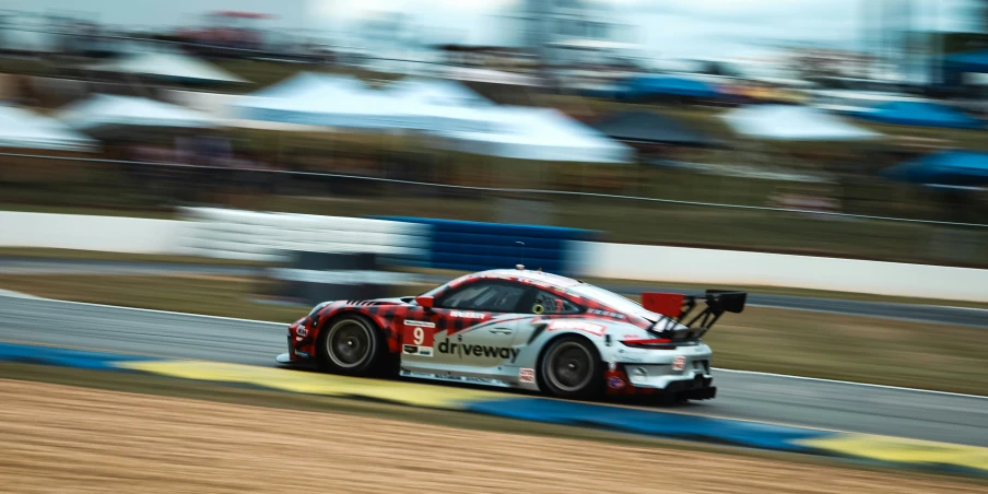 a car on a track with the number 13 racing