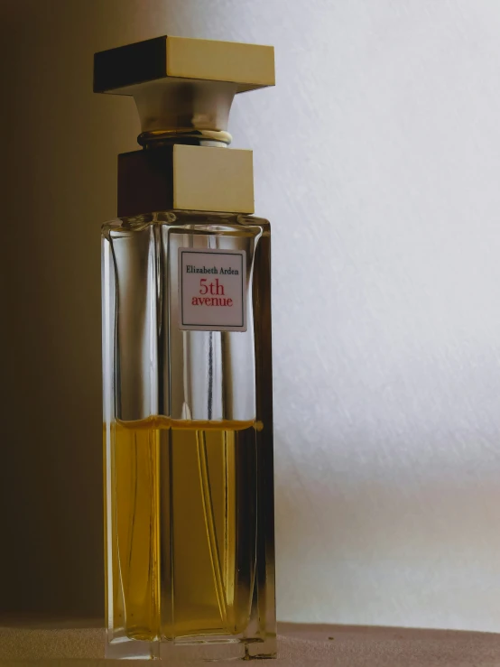 an open bottle of perfume on a table