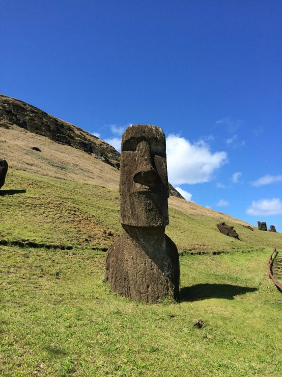 some large sculptures in the middle of a grassy field