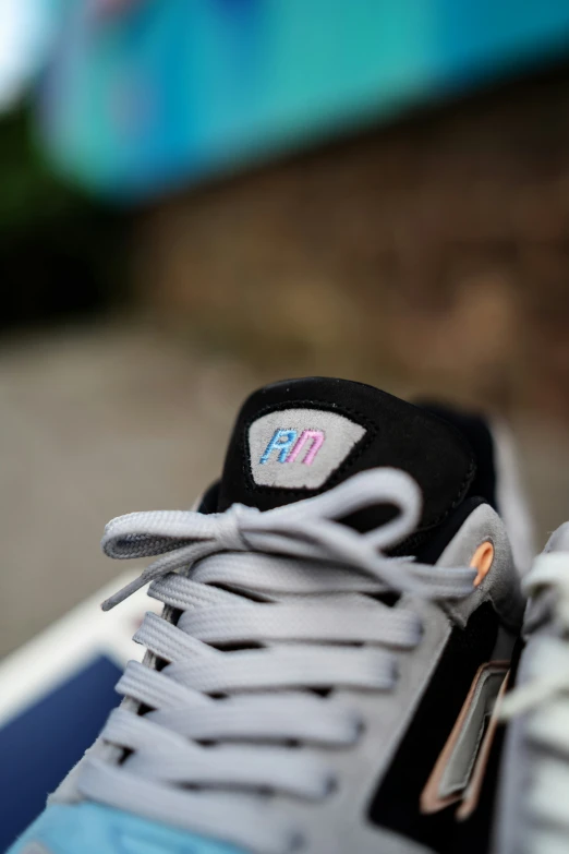 sneakers with white and black straps on the top