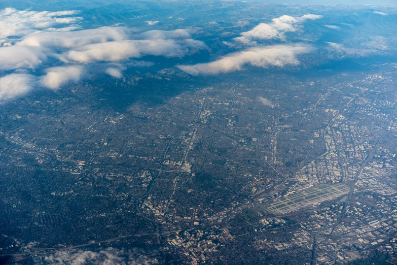 an aerial view of some large white clouds