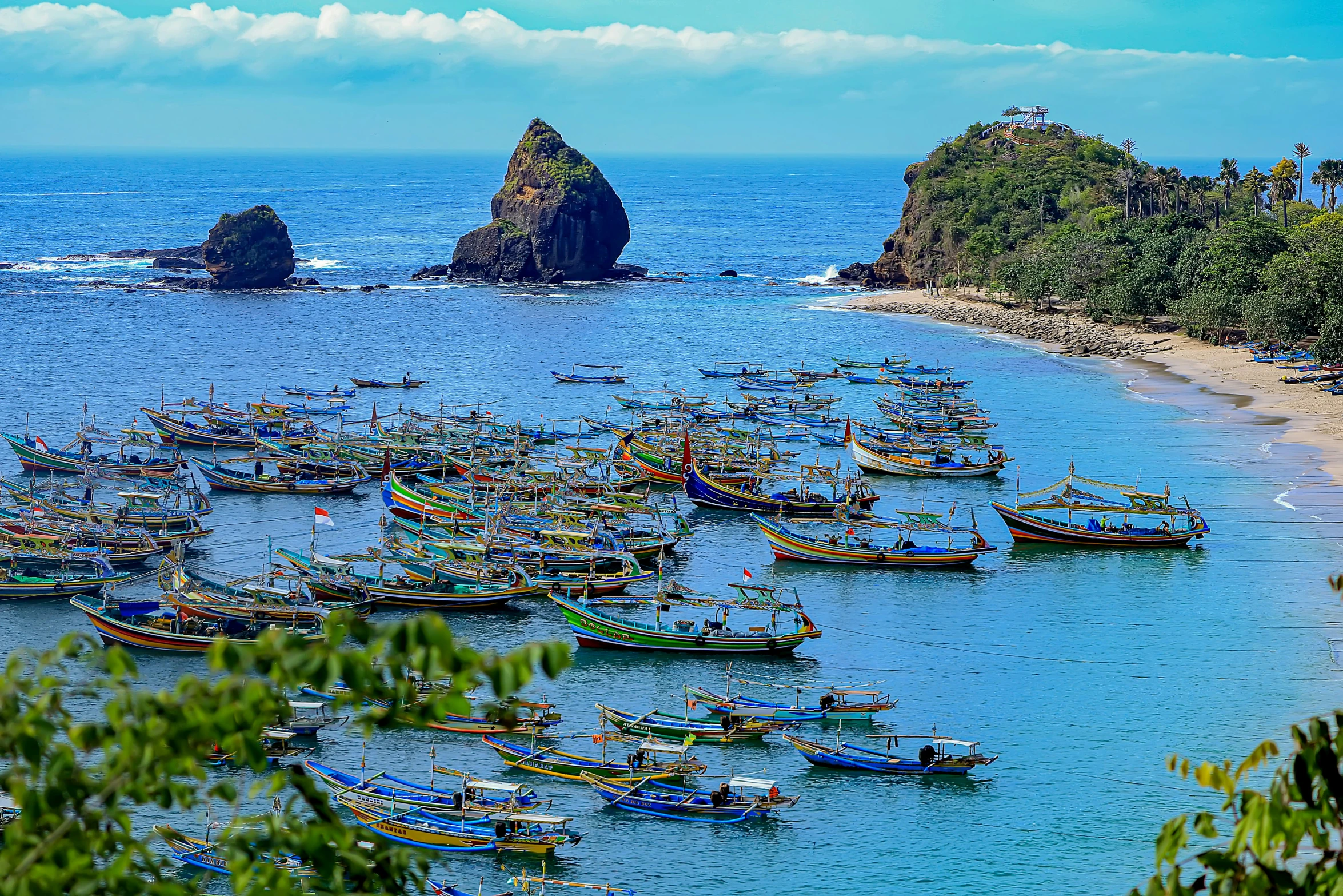 there is a lot of boats docked along the shore