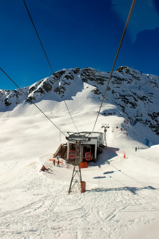 a ski lift and chairlift on the mountain side