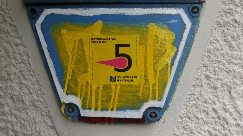 a sign that reads five five with yellow water