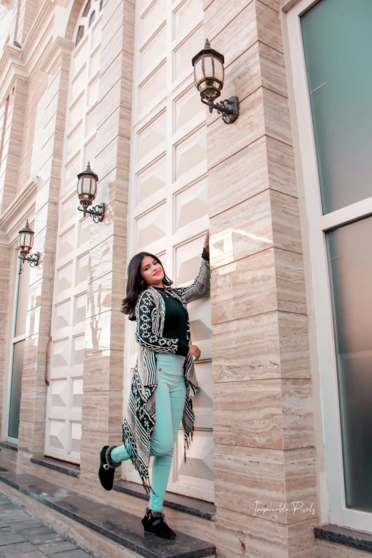 a beautiful woman wearing a green and black outfit