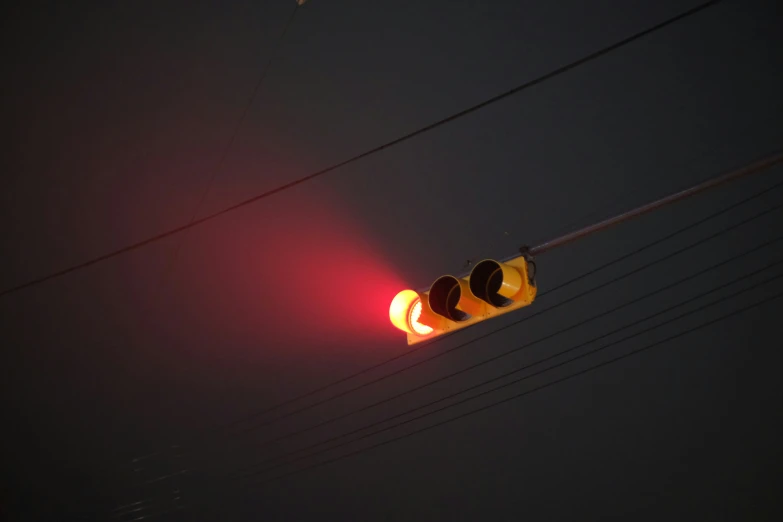 the street light is red and the signal light is yellow