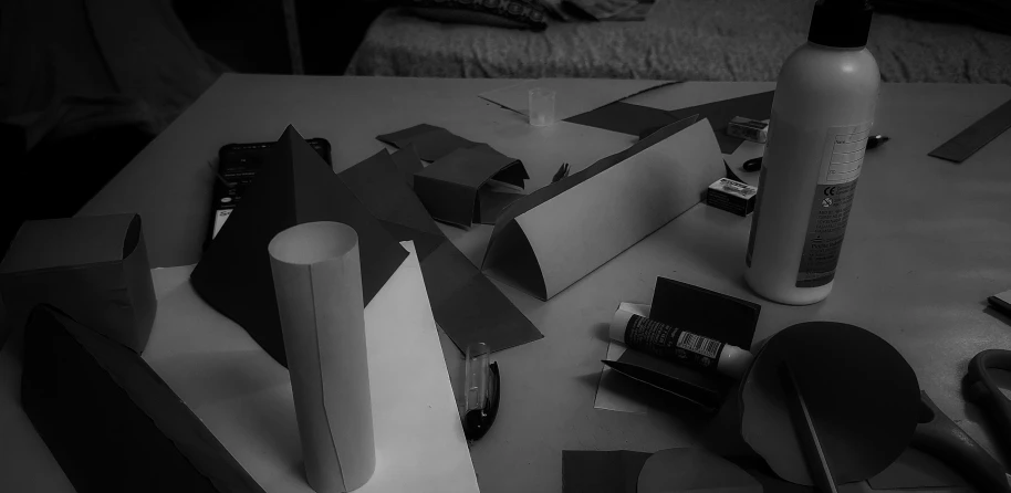 a black and white image of art materials on a table