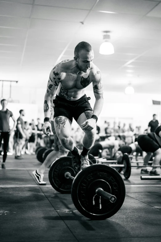 a man is doing a large set of barbells