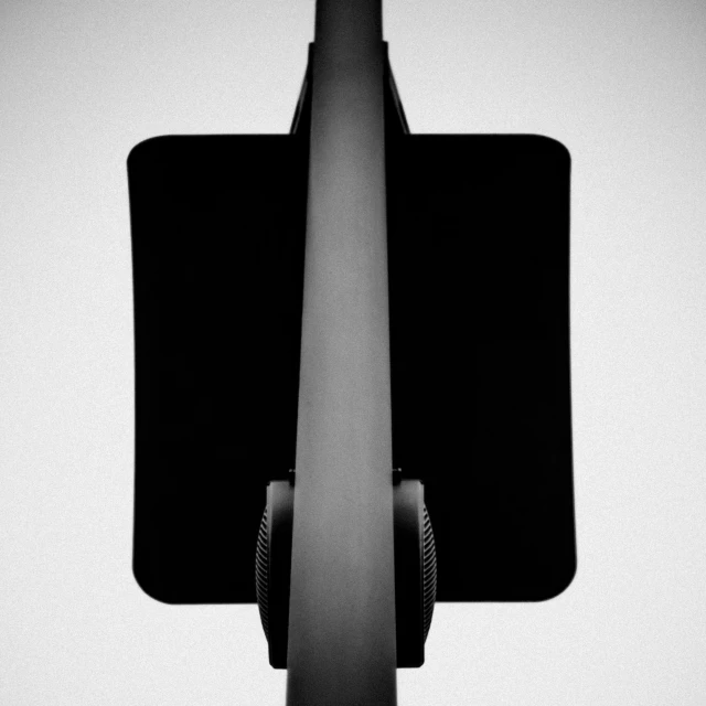 an odd looking street light in the black and white po