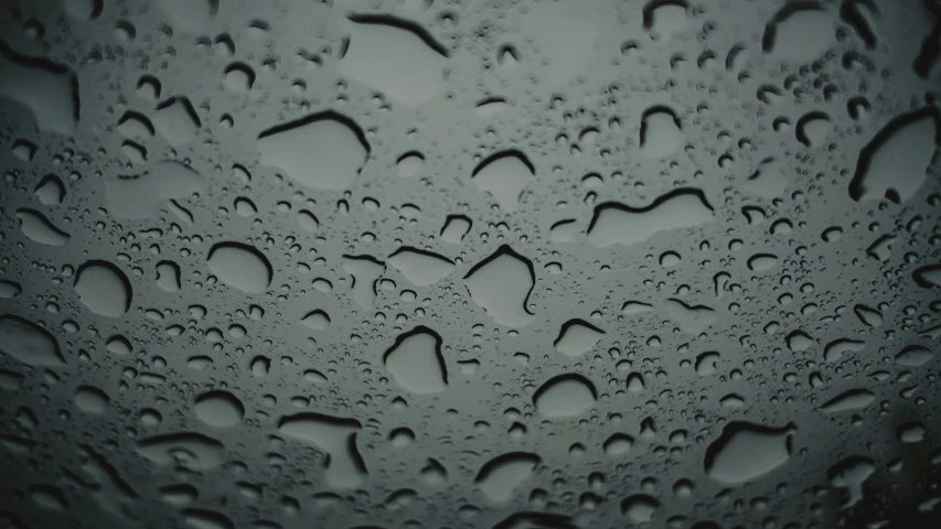 an image of rain and water on a windshield