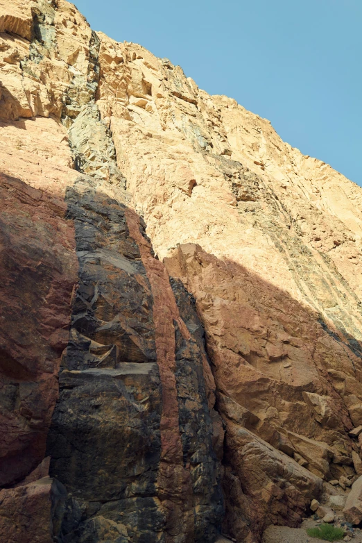 a man climbing on a rock face
