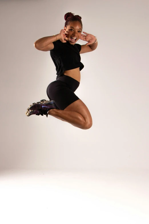 a woman with very many muscles leaping in the air