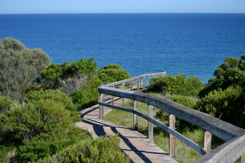 the stairs lead up to a scenic view of the ocean