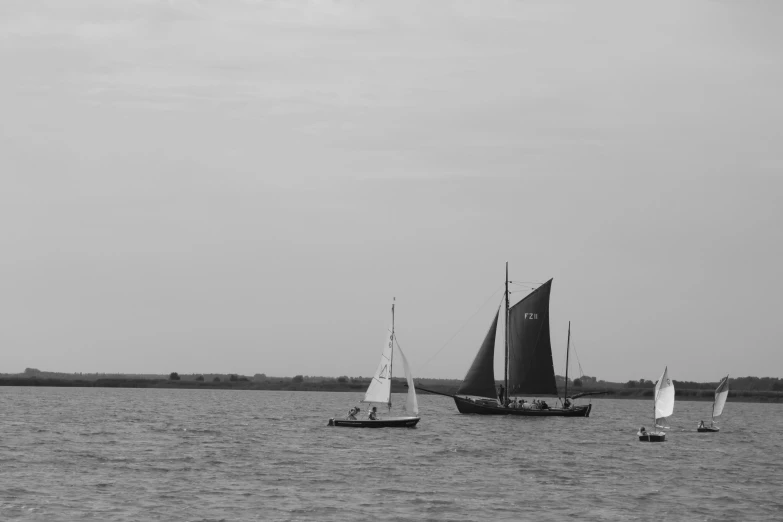 some small boats are on a large body of water