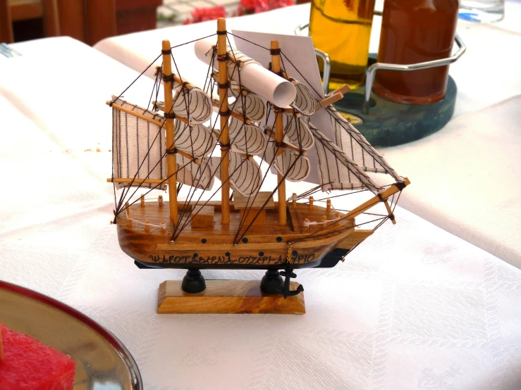 a boat model sitting on top of a white table