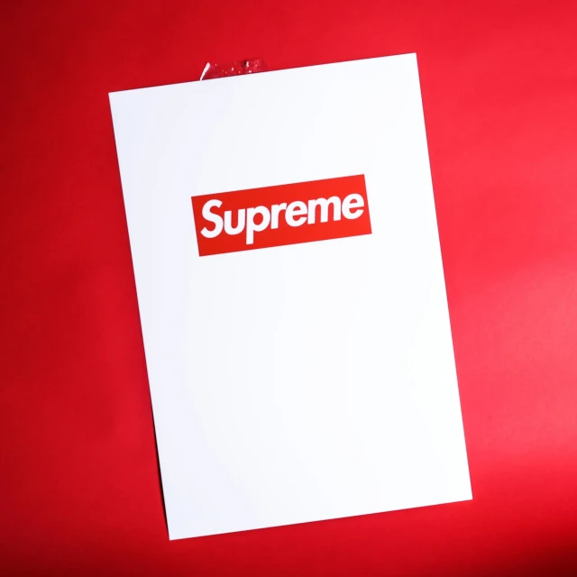 supreme logo on a white paper