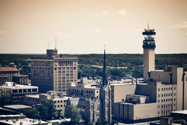 a large clock tower towering over an urban landscape