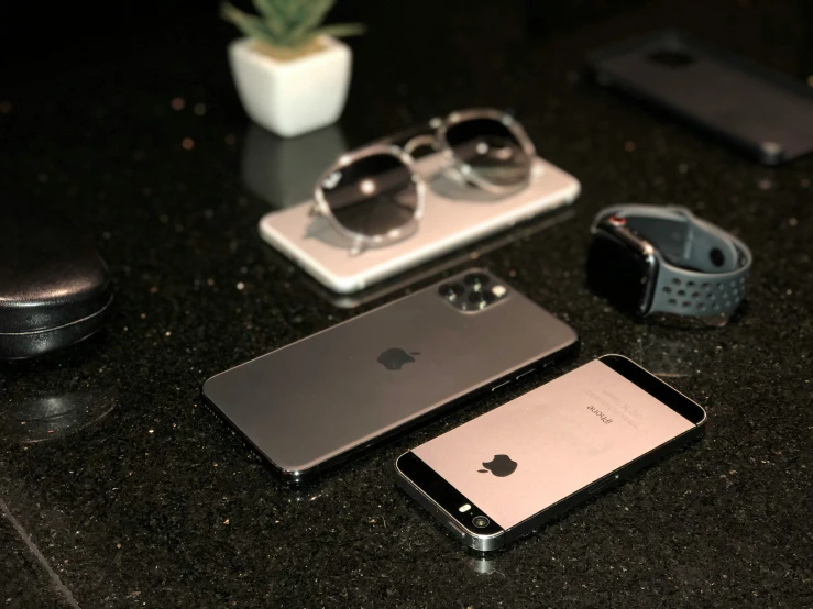 some accessories are laying out on a black table