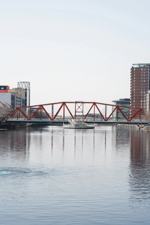 a bridge with a building in the background