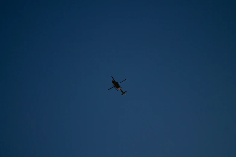 an airplane flying through the sky during the day