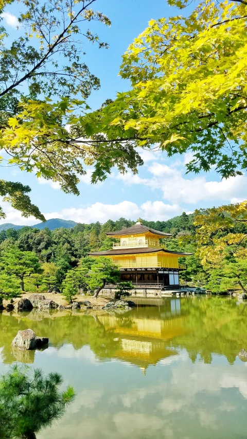 an old asian pagoda in the forest by water