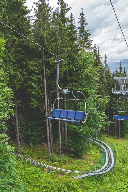 an overhead cable car on top of a hill