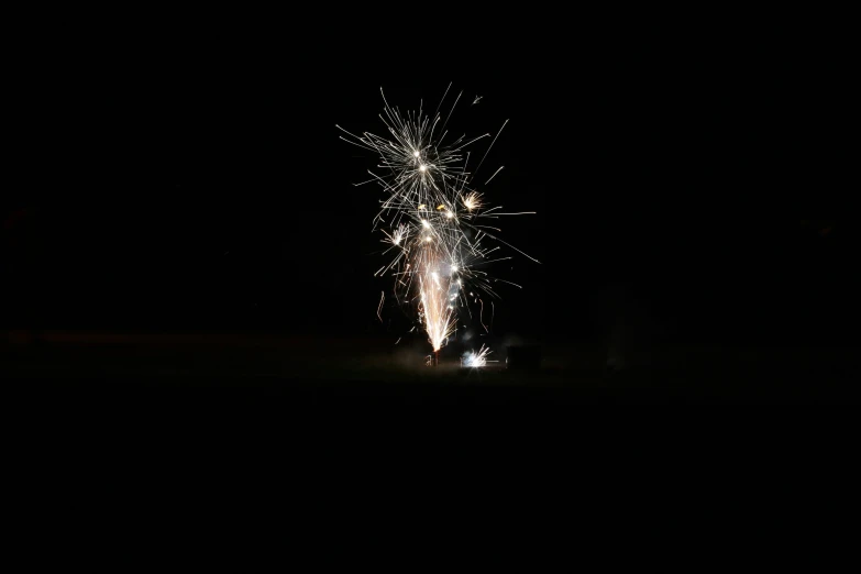 fire works in the dark with only one visible