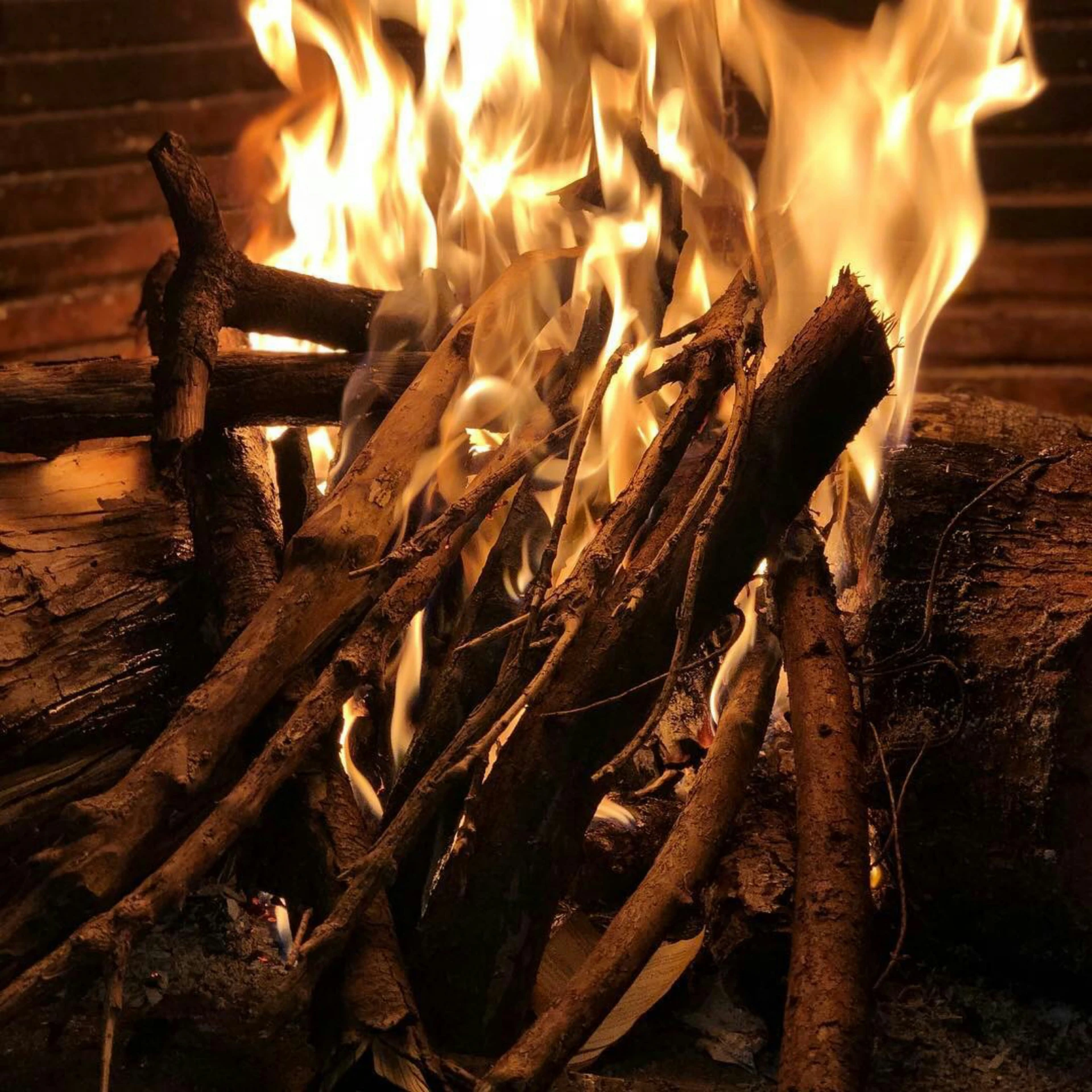 an open fire with logs and flames