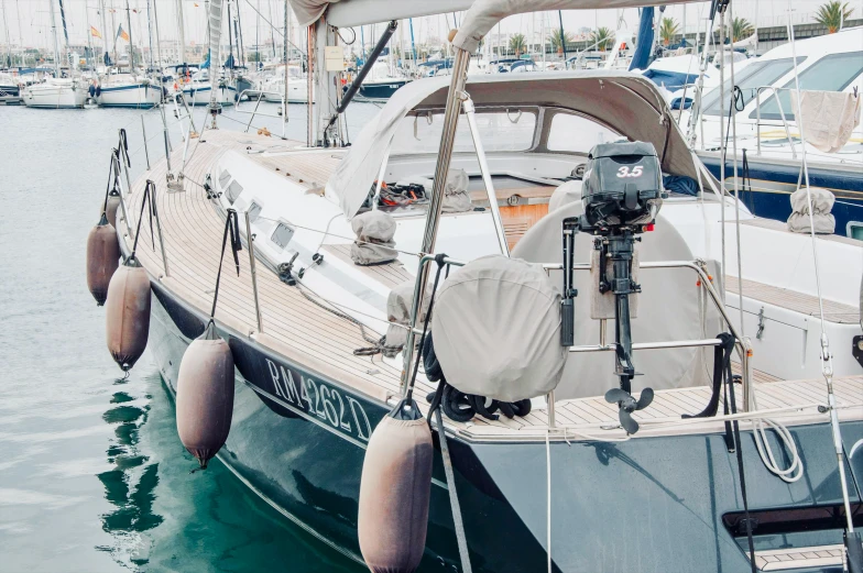 an elegant sailboat parked at the dock