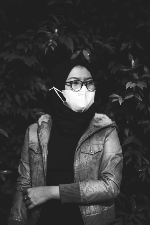 woman in black and white wearing protective mask