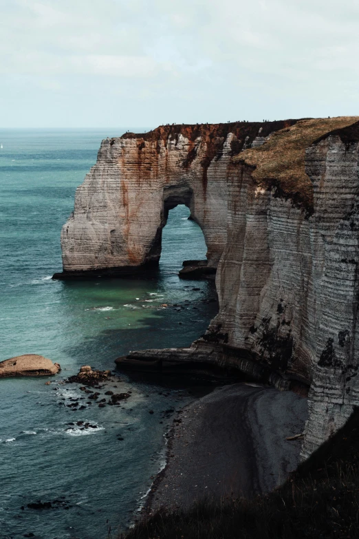 a large body of water next to the shore