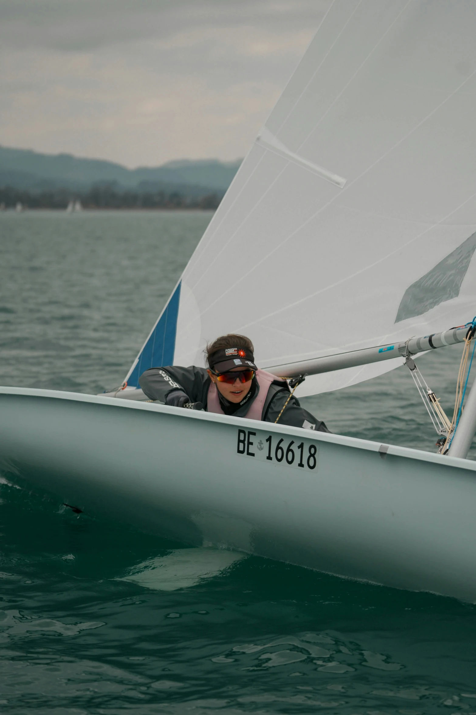 a young man on a boat in the water