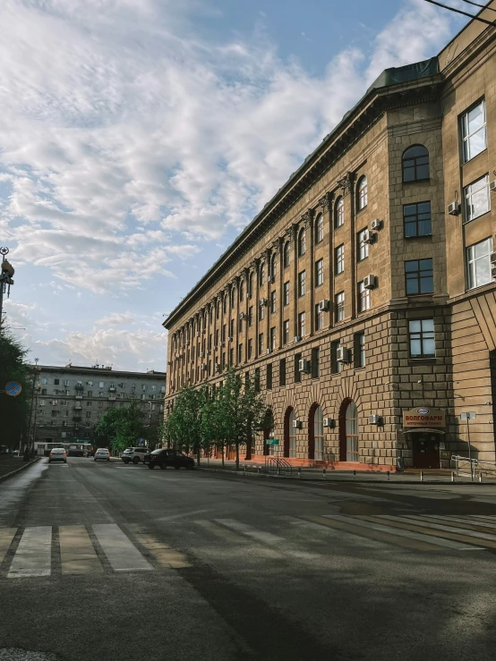 there is an empty street in front of this old brick building